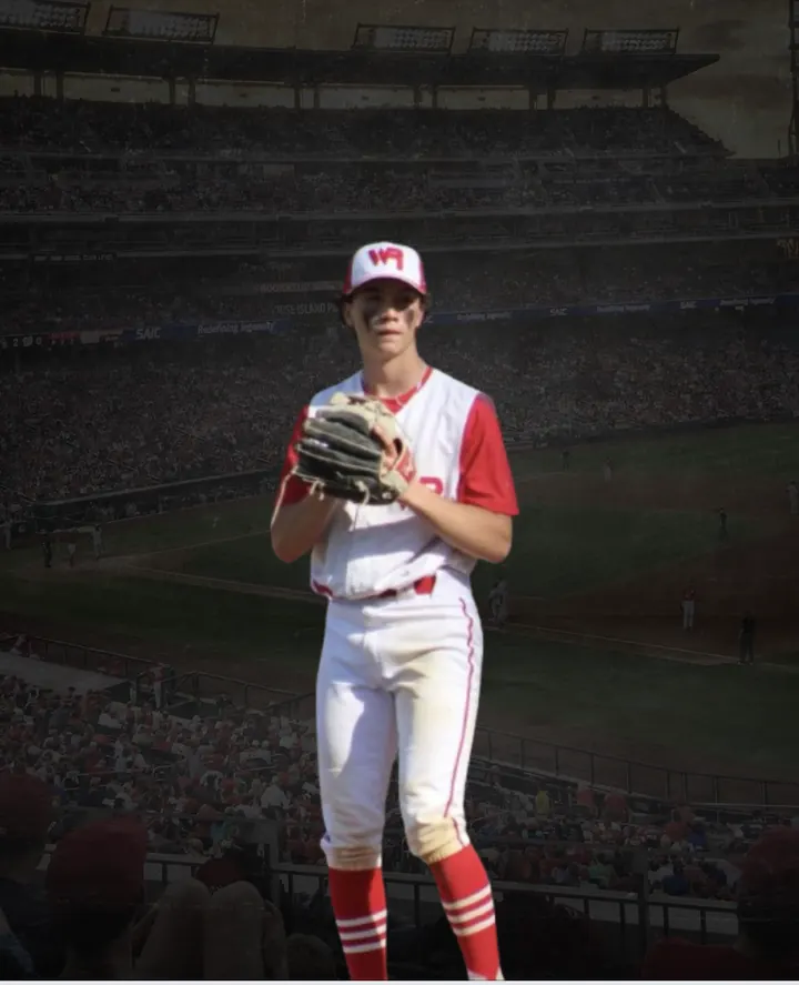 Ethan standing on the field holding his glove